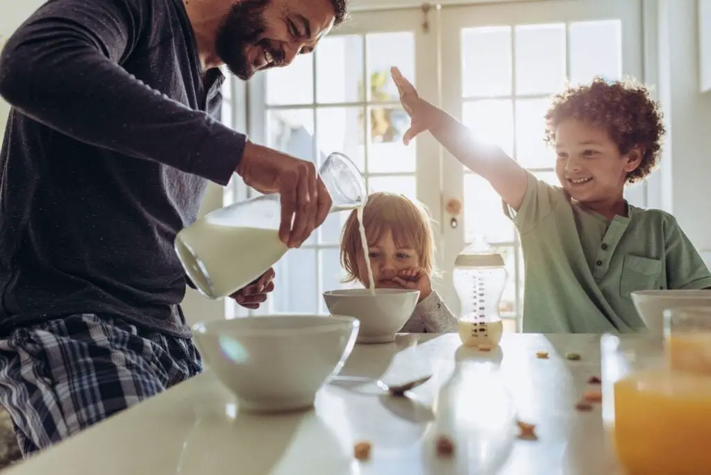 children drinking pure milk with dad