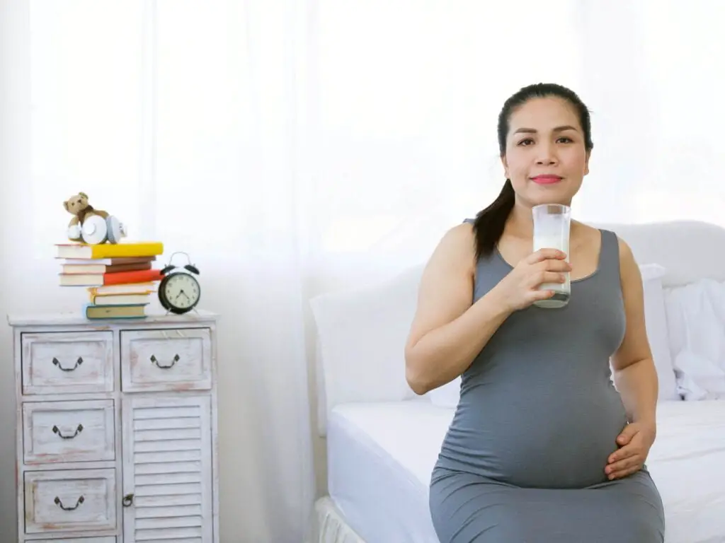 Pregnant mother drinking milk