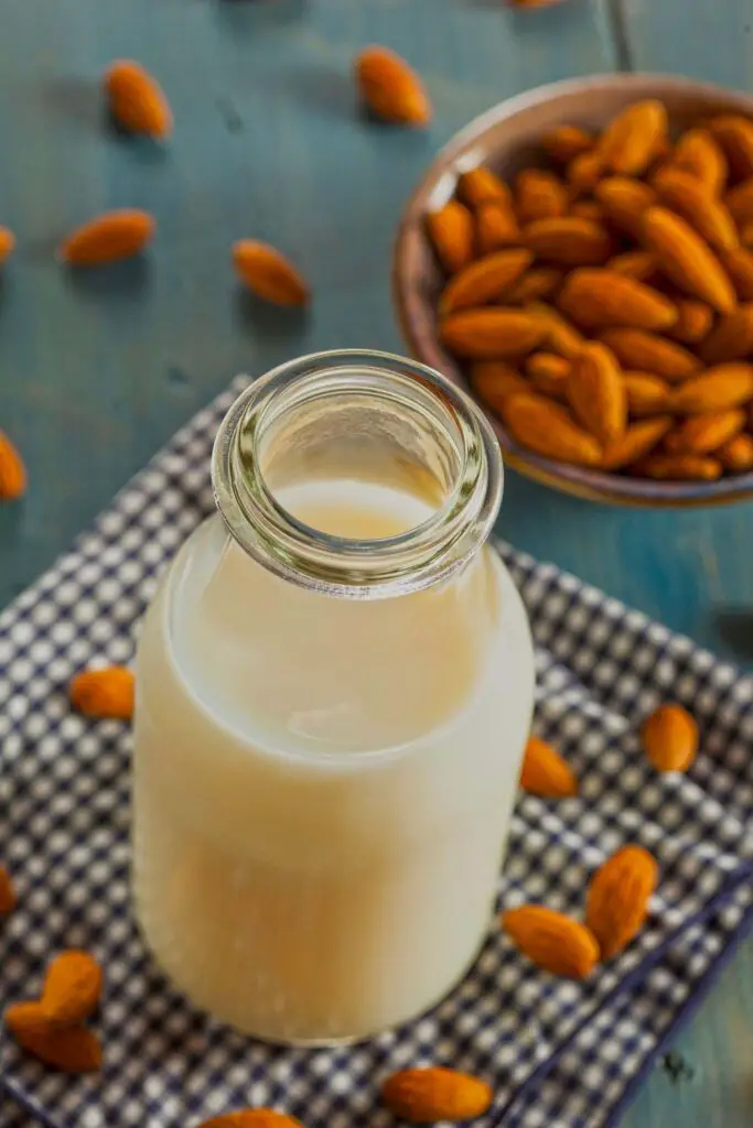 Almond milk bottle and almonds