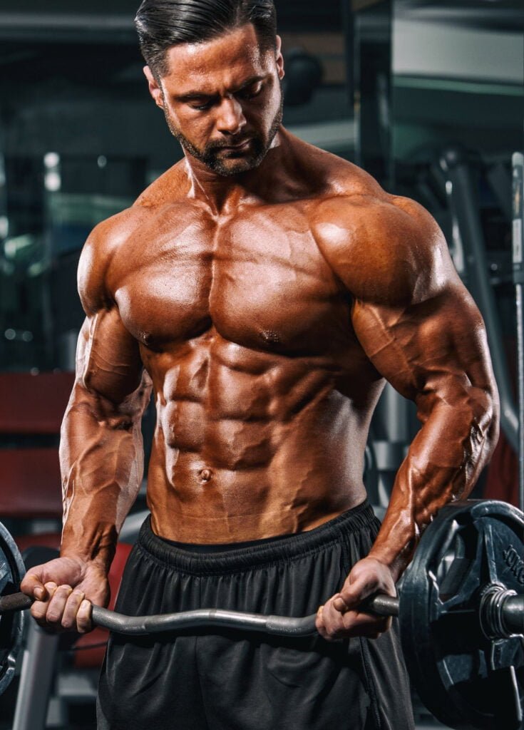 Bodybuilding guy doing muscle