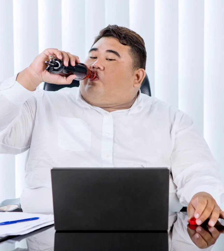 Obesity man drinking soft drink