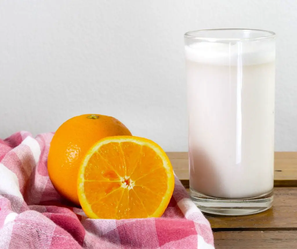 Orange slice and milk glass