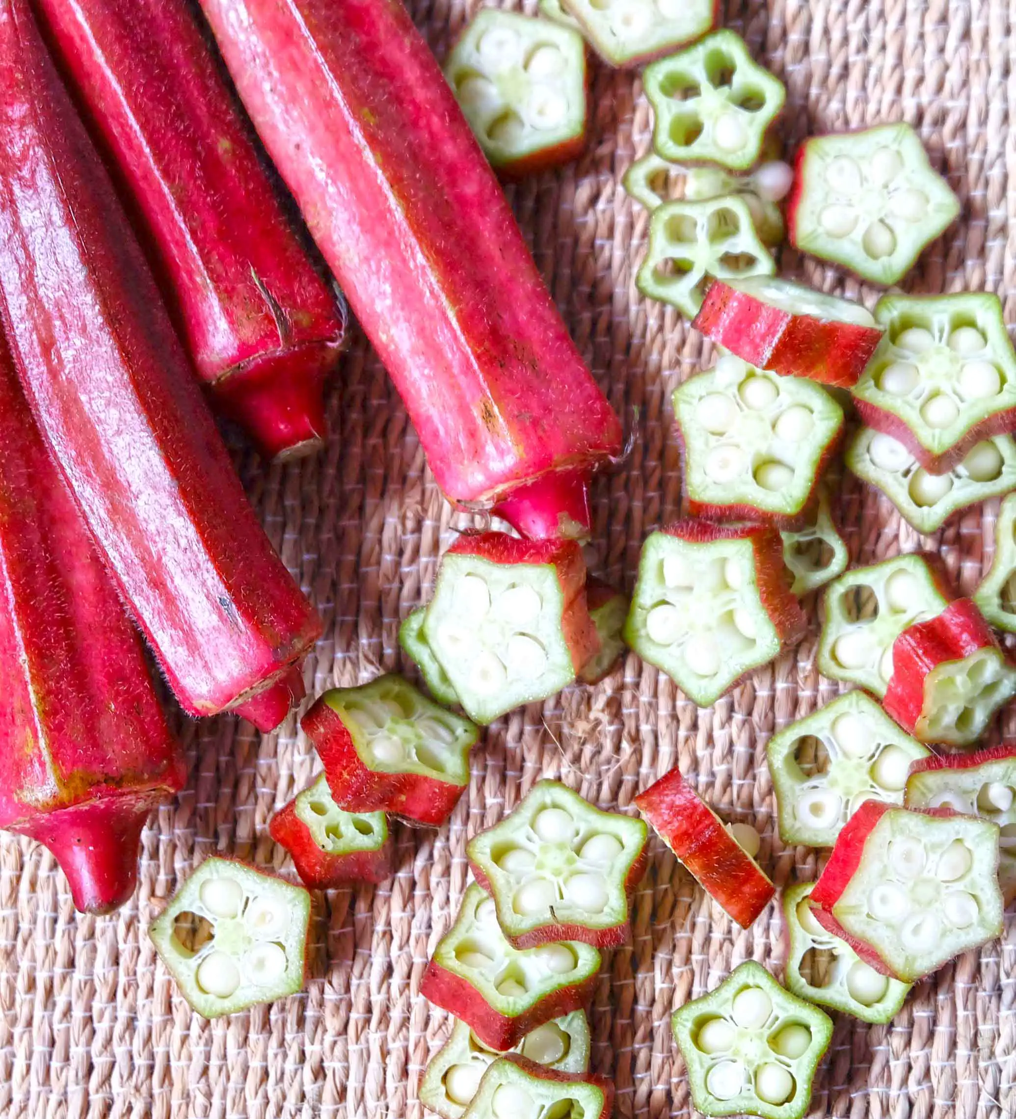 Red okra pods and slices