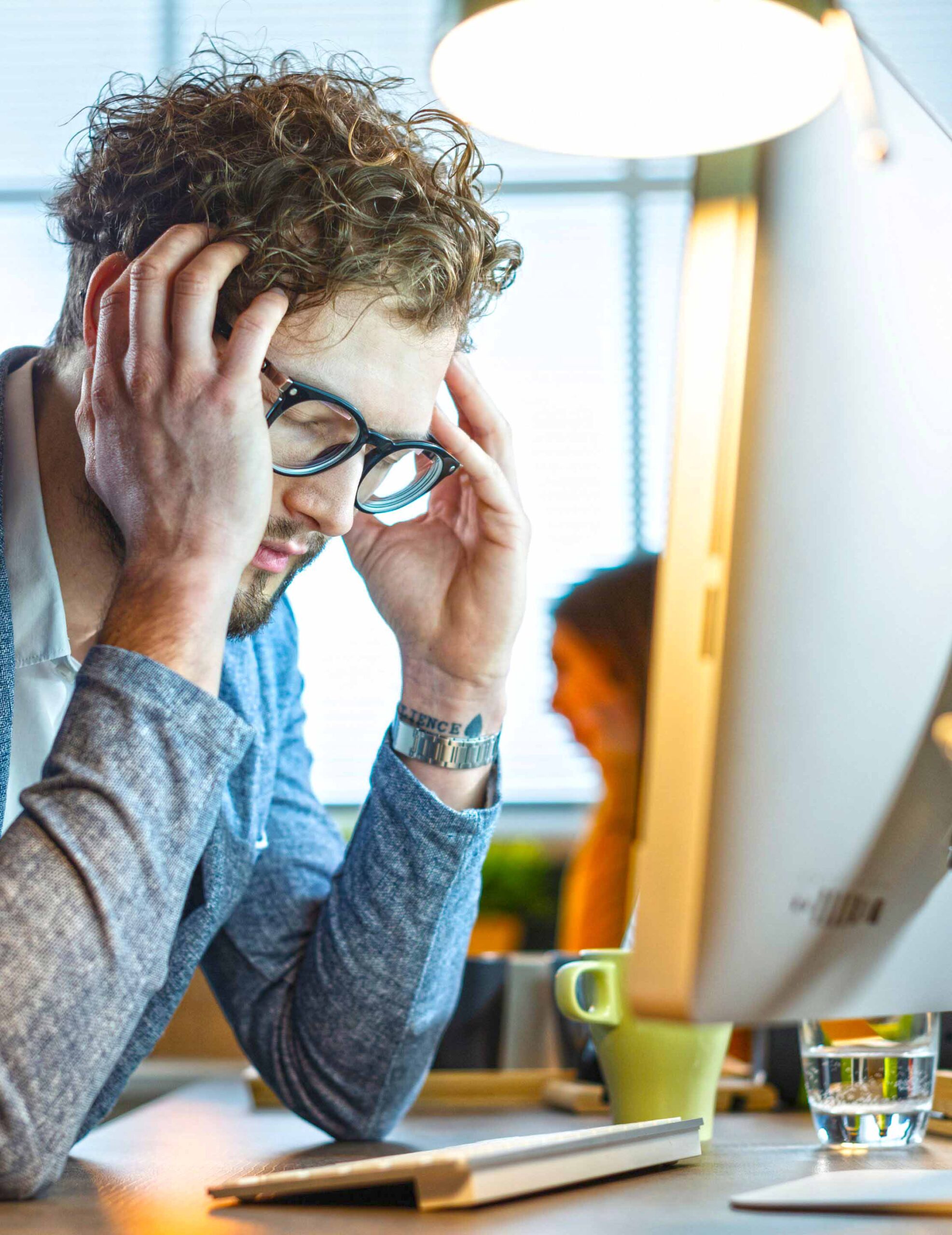 Boy stressed in the office